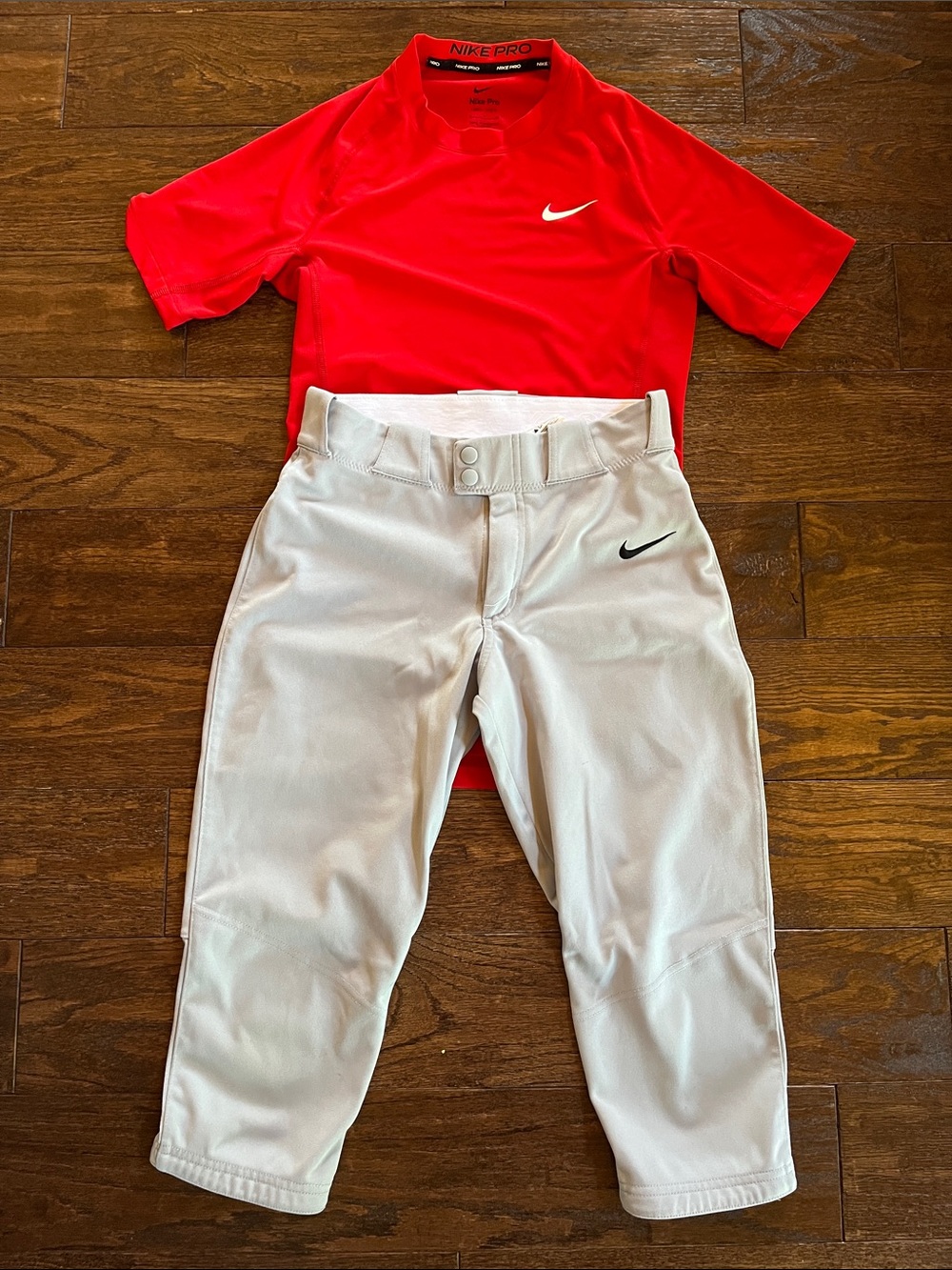 Nike men’s gray baseball pants knickers and red dri-fit t-shirt. Size small.